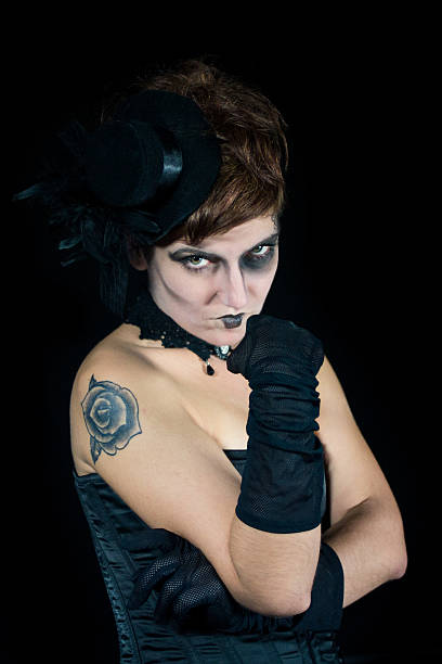 istock Young make up woman with tattoo, isolated on black 610782888