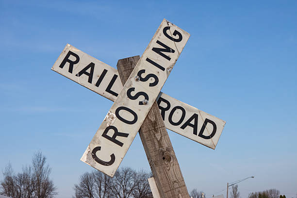 istock Railroad Crossing Sign Against Blue Sky 610783518