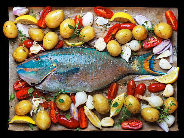 Whole parrot fish ready for the oven Whole parrot fish ready for the oven parrot fish stock pictures, royalty-free photos & images