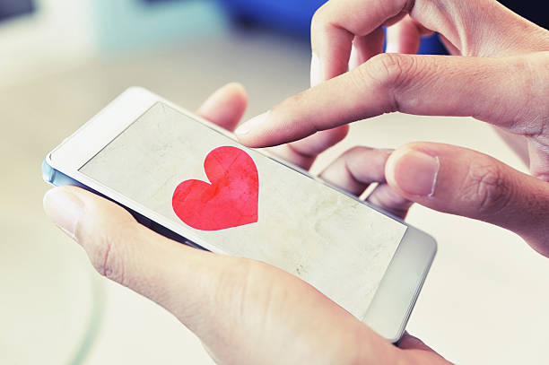 istock find love on smart phone 610784298