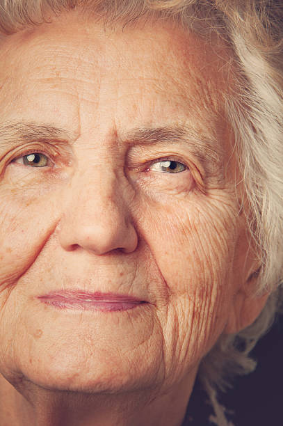 istock Beautiful Senior Woman Outdoors Lost in Thoughts 610786262