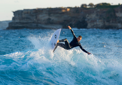 Sydney, Australia -September 28, 2016. Young surfer surfing at Tamarama beach.