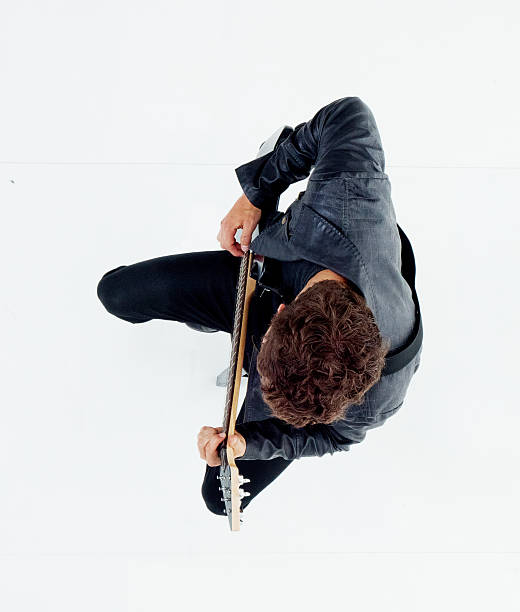 istock Above view of man playing guitar 610836990