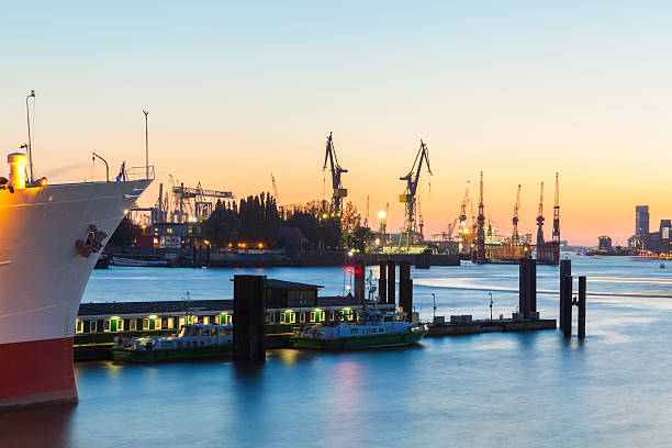 Wilhelmshaven, Germany - July 15, 2013: Container terminal of the Jade Weser Port at night. Loading of a Container Ship. , Lower Saxony, Germany, Europe