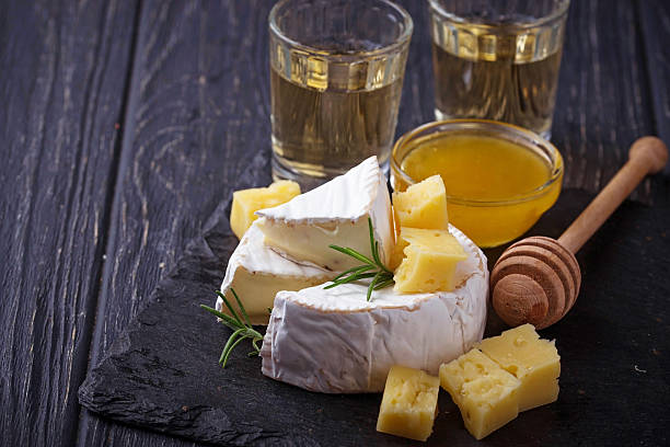 istock Camembert cheese with honey and wine 610838308