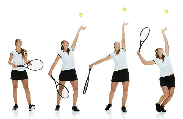 weibliche tennis spieler, die den ball - arms outstretched arms raised studio shot adult stock-fotos und bilder