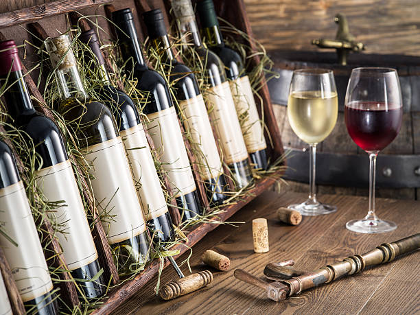 istock Wine bottles on the wooden shelf. 610840870