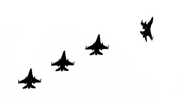 istock Silhouettes of fighter jets 610843084