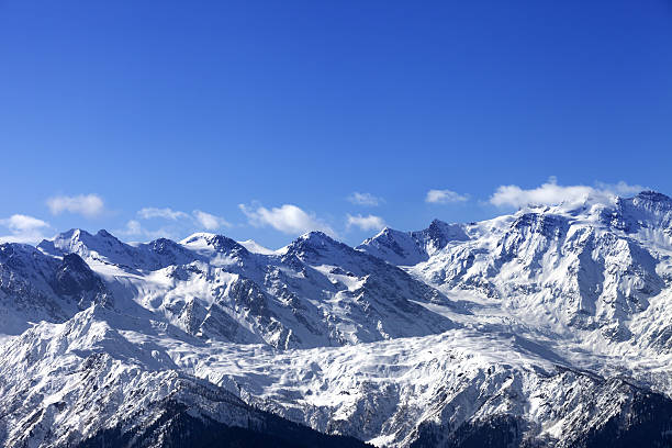 istock Snow winter mountains in nice sunny day 610843376