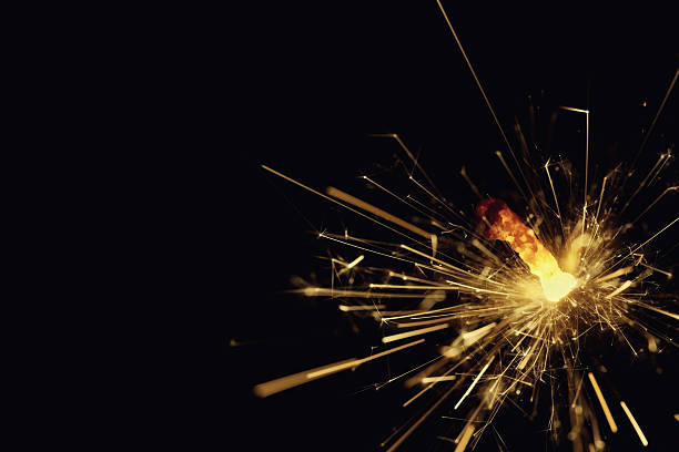 istock Burning bengal fire or sparkler on black background 610844330
