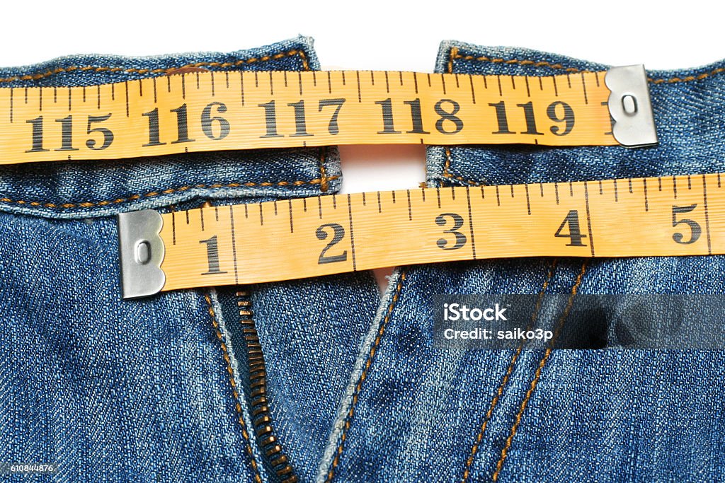 Jeans and tape measure isolated Jeans and tape measure Casual Clothing Stock Photo