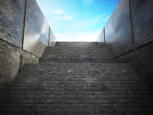 Staircase leading up to blue sky.