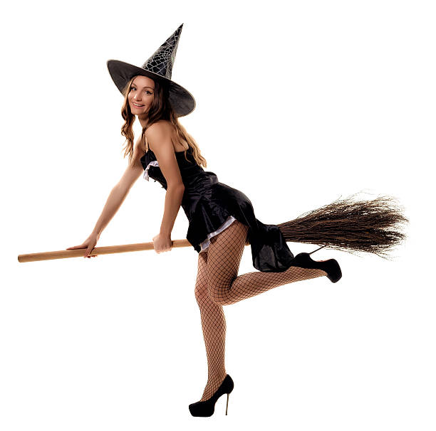 istock young woman in a witch costume posing in studio 610846262