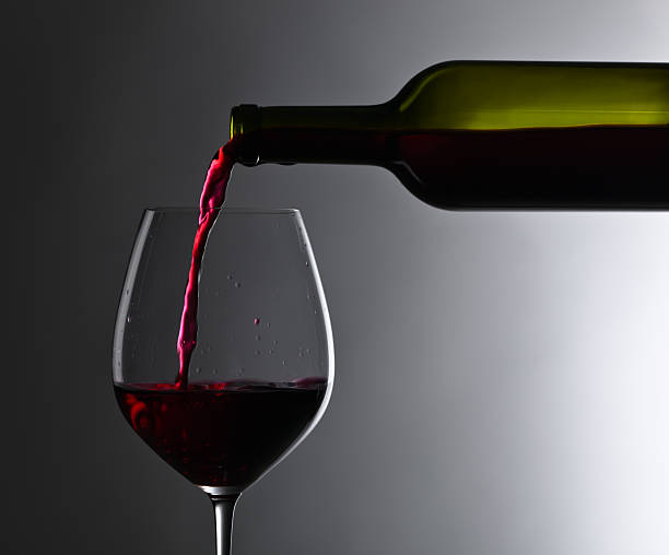 istock bottle and glass of red wine 610846954