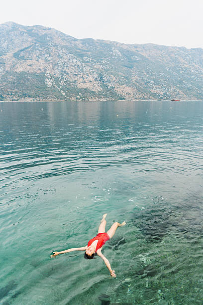istock Woman swimming in Kotor bay 610851342