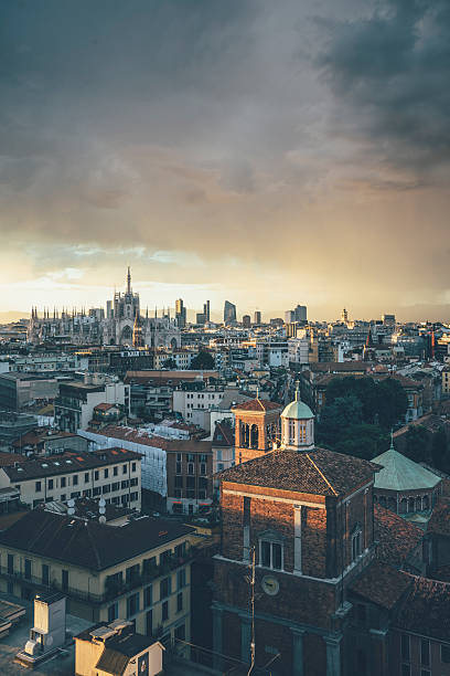 Milano, 2016 panoramic skyline with Italian Alps on Background - stock photo