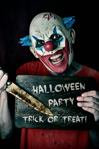 istock evil clown and text Halloween party trick or treat 610852664
