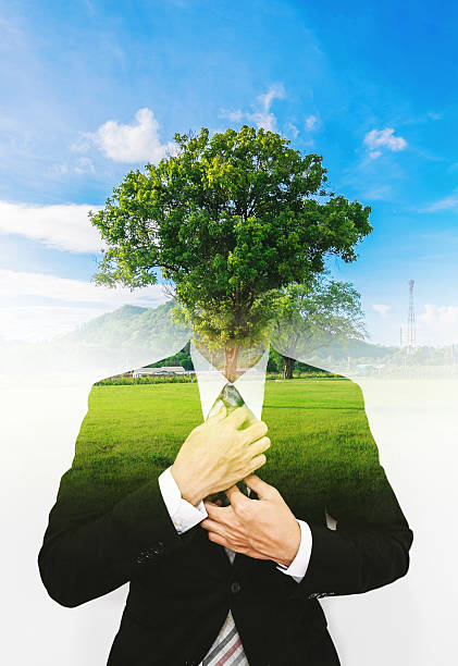 istock Double exposure businessman with a tree with blue sky 610852738