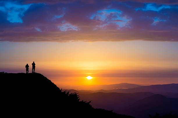 istock Silhouettes of two people 610853350