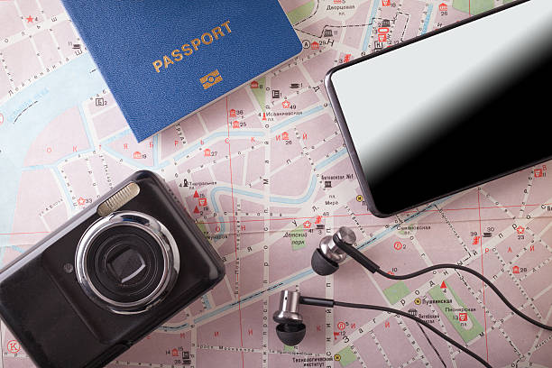 istock Preparation for Traveling concept, passport, smartphone, camera, map on a 610854492