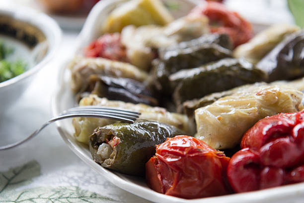 a variety of summer vegetables stuffed with ground beef, rice, garlic, and herbs
