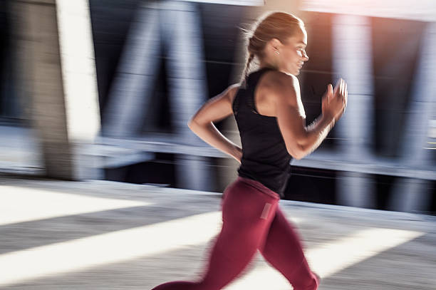 istock Female Athlete Running Outdoors 610857286