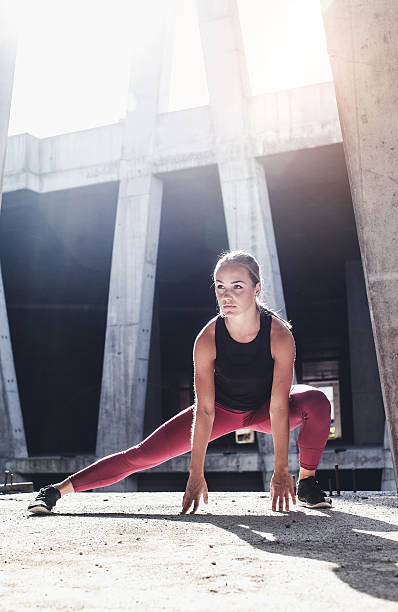 istock Female Athlete Stretching Outdoors 610857322