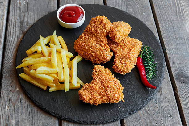 istock Breaded crispy chicken wing fried french fries sauce 610860204