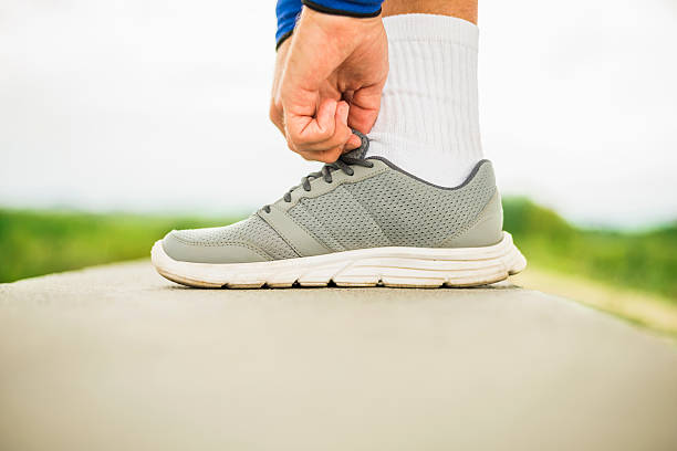 istock Runner putting his shoes on 610861222
