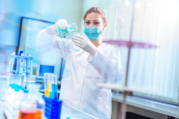 istock Confident female scientist examining medical samples in laboratory 610861990