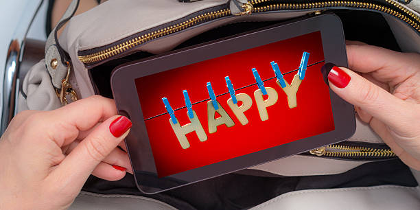 istock happy tablet in her purse 610864062