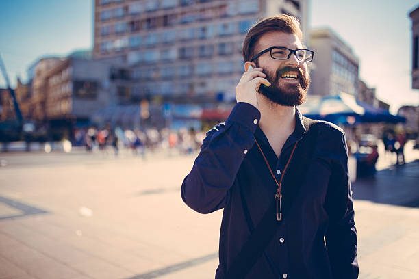 istock Hipster businessman talking on the phone 610864104