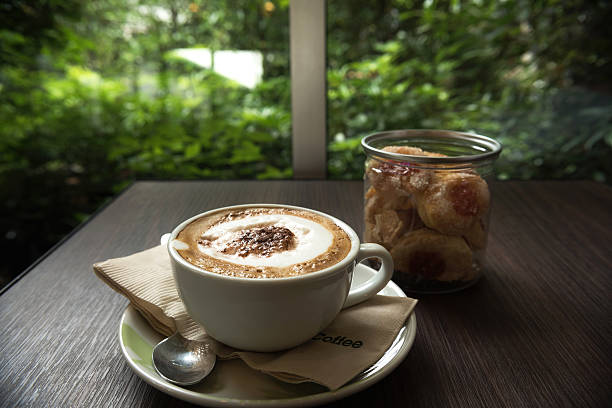 Coffee cup with cookie for serve in living room