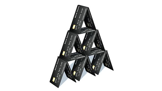 istock Credit card pyramid isolated on white 610867146