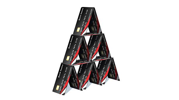 istock Credit card pyramid isolated on white 610867470