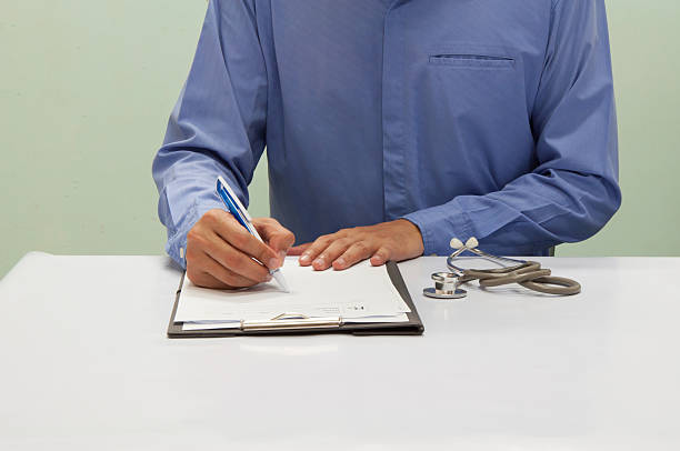 istock Doctor writing a medical prescription. 610867768