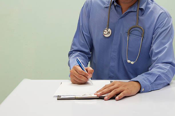 istock Doctor writing a medical prescription. 610867820