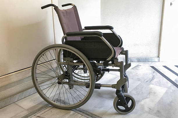 istock wheelchair in hospital corridor 610870022