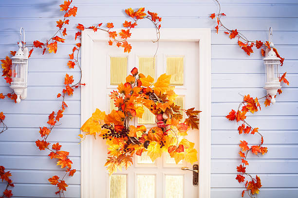 istock Autumn wreath entwined with leaves, garlic, berries 610870090