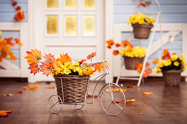 istock Decorative bicycle with basket with yellow  leaves 610870180