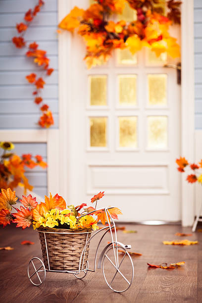 istock Small white bicycle with autumn leaves. Vertical. 610870254