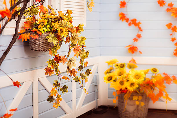 istock Basket with flowers and autumn leaves 610870312