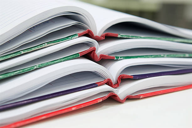 istock Open of many report book on desk 610870644