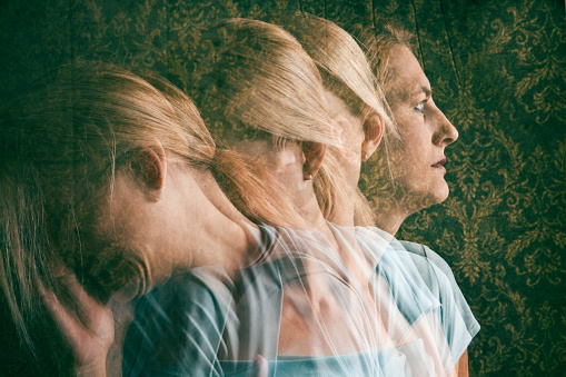 A multi-exposure image of a depressed woman.