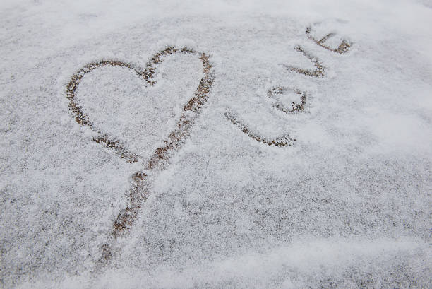 istock love drawing on snow in the winter 610872030