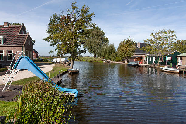 istock Slide and natural swimming pool 610872368