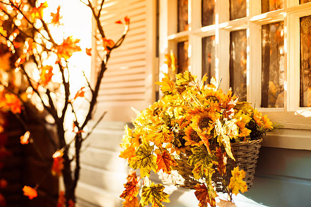 istock Basket with sunflower and autumn leaves 610872722