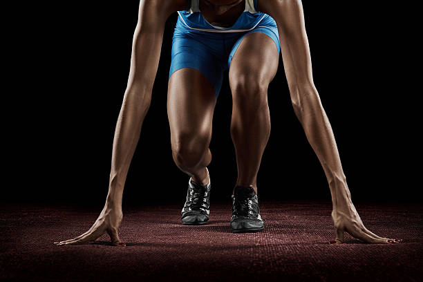 istock Beautiful athlete on a race track is ready to run 610873868