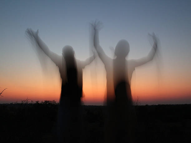 istock Jumping blurred people against the sunset 610874006