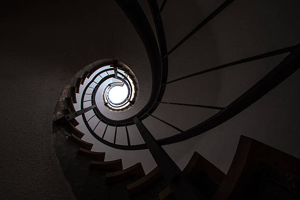 istock Spiral staircase in a public building 610875252